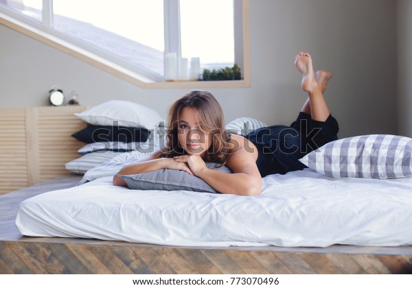 Young looking teen on bed