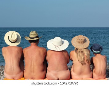 Naked at the beach family