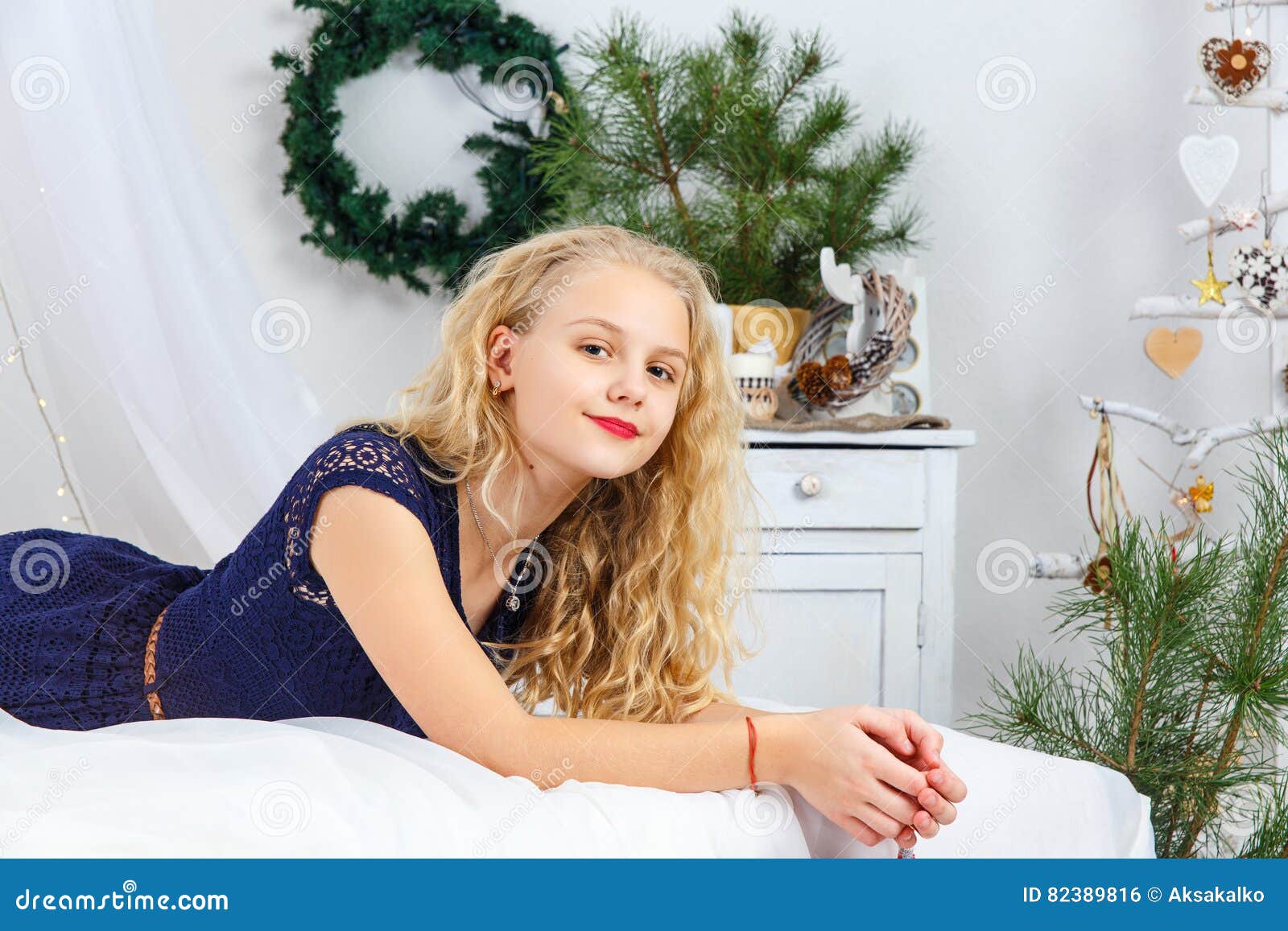 Young looking teen on bed