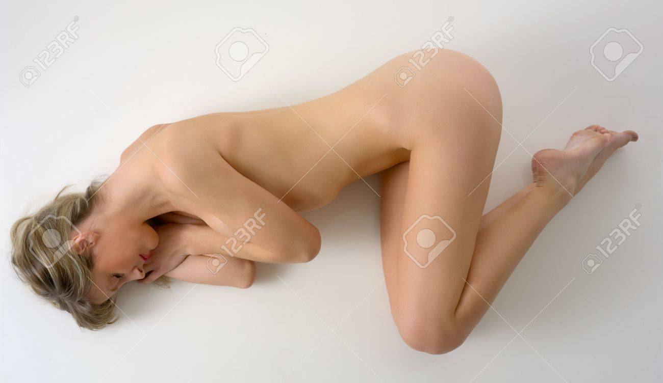 Naked girl seen from behind lying down