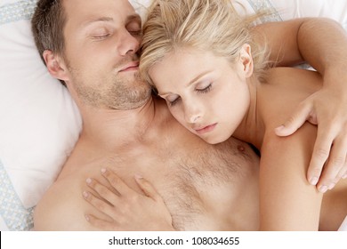 Nude couples on bed