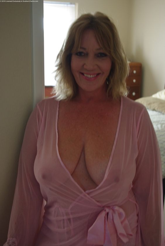 Mature woman in see through sheer blouse