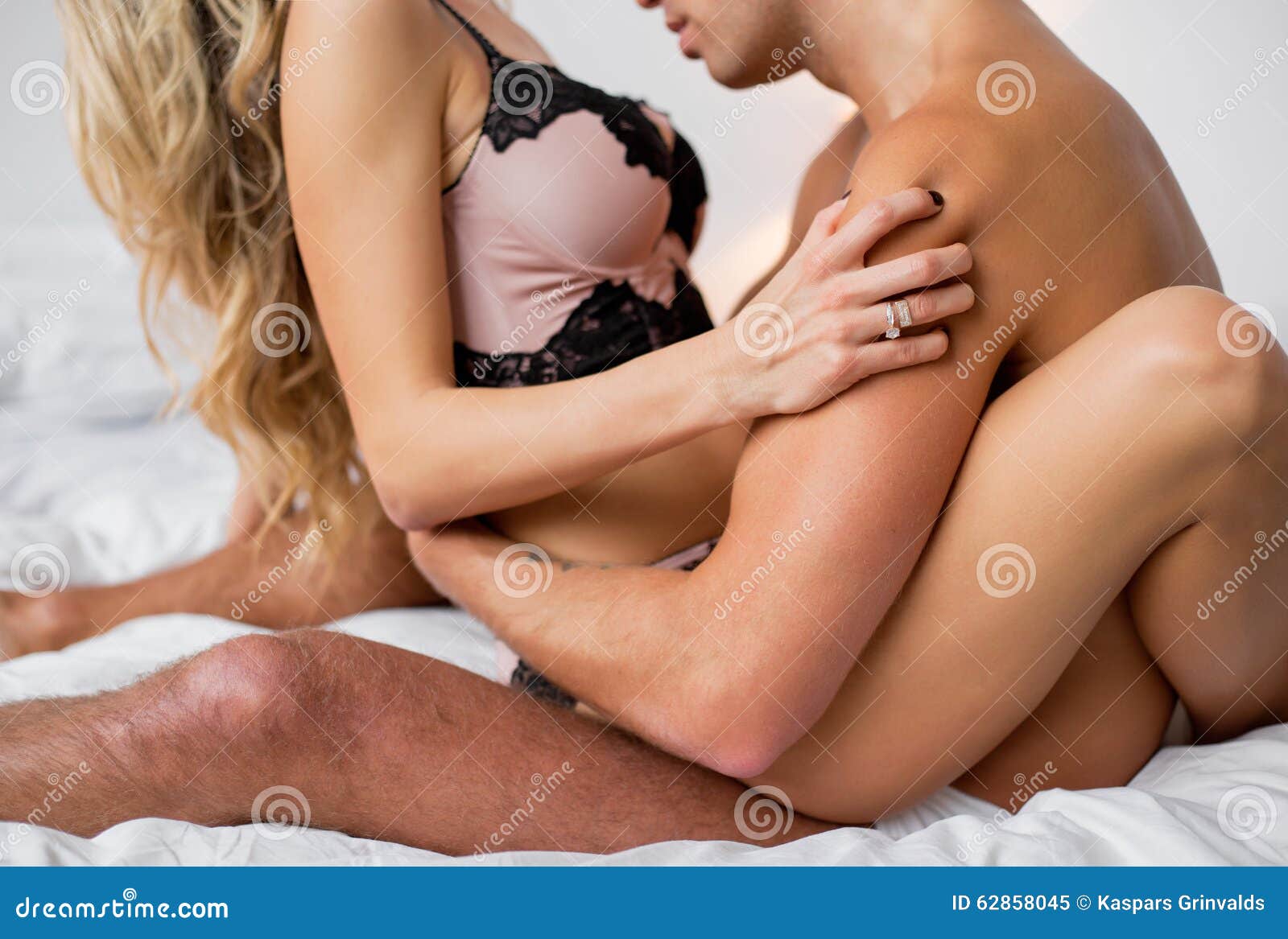 Men kissing women breast