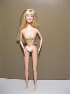 Girl looks like barbie doll nude