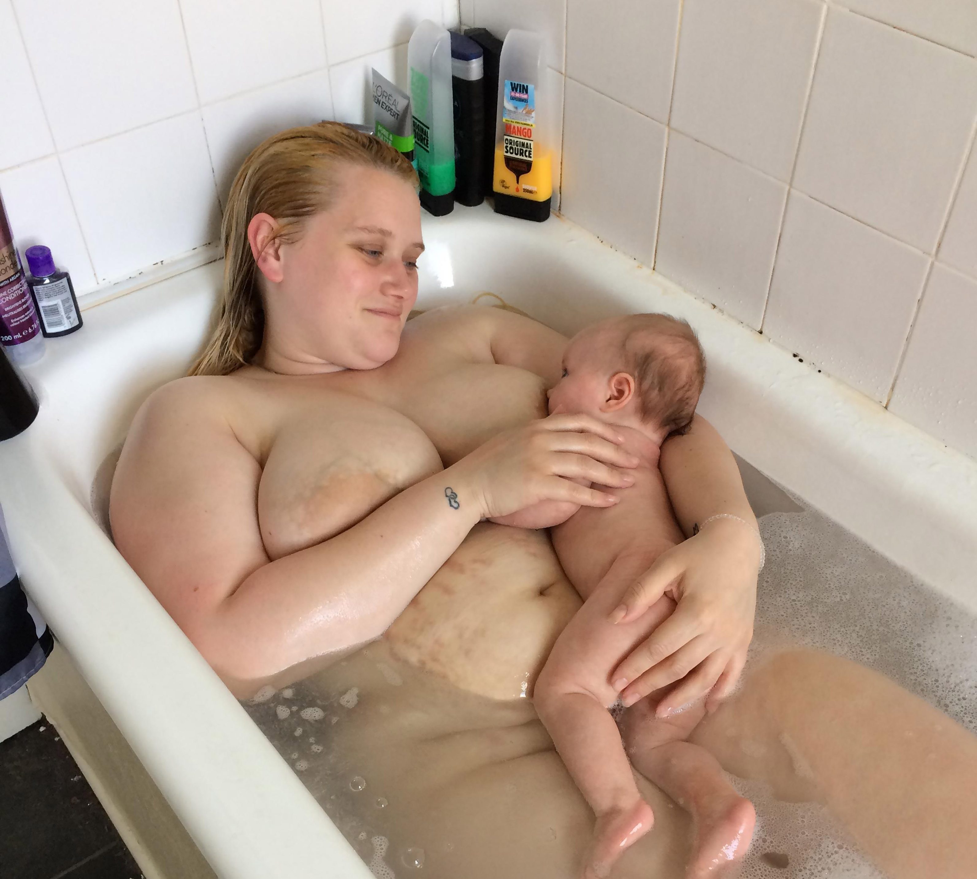 Breastfeeding large breast nude