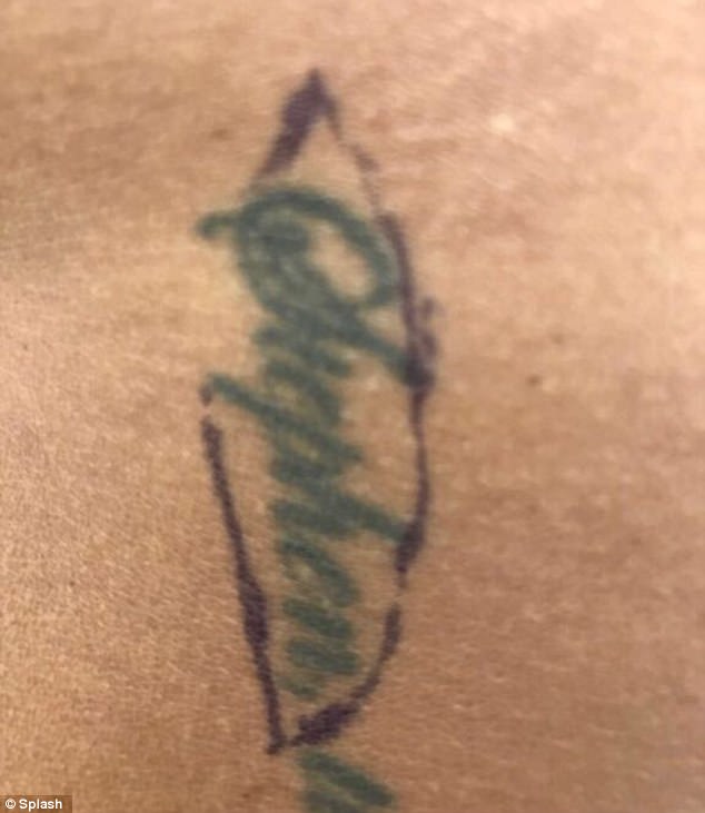 Girl cuts off arm tattoo