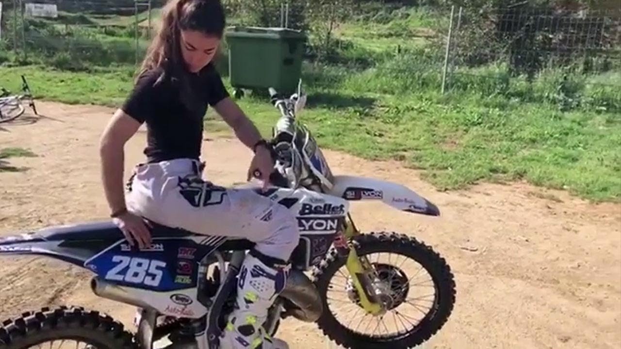 Naked girl dirt bike riding a motorcycle