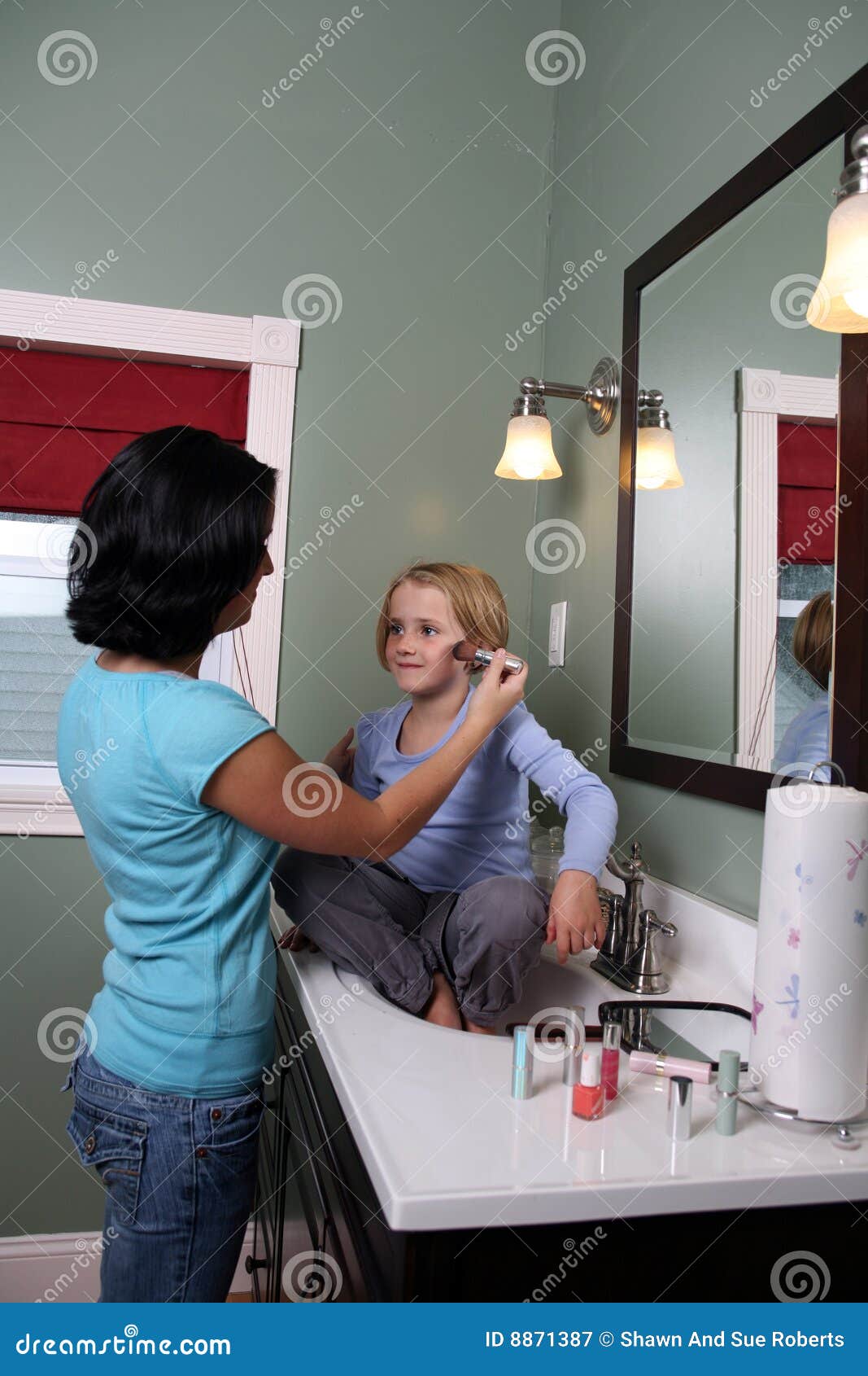 Teen girl sitting on sink