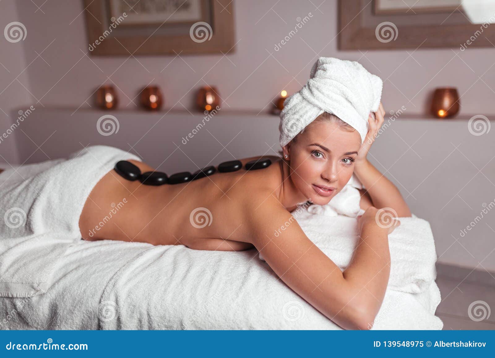 Girl naked on a massage bed